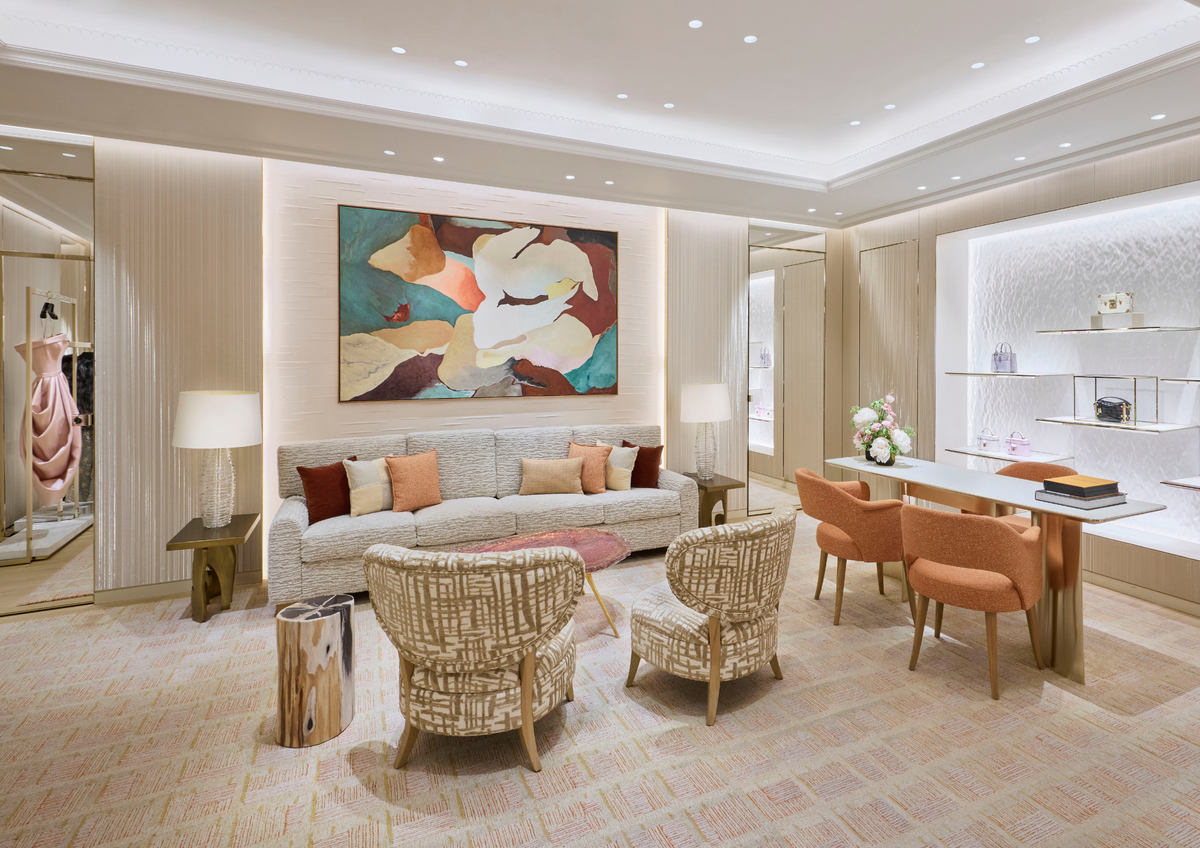 Lounge with woven armchairs beneath a large abstract painting, Louis Vuitton Harrods