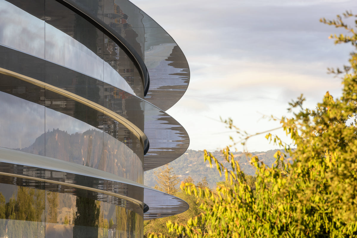 Curved glass façade with canopies wrapping each floor, Apple Park, Cupertino, California