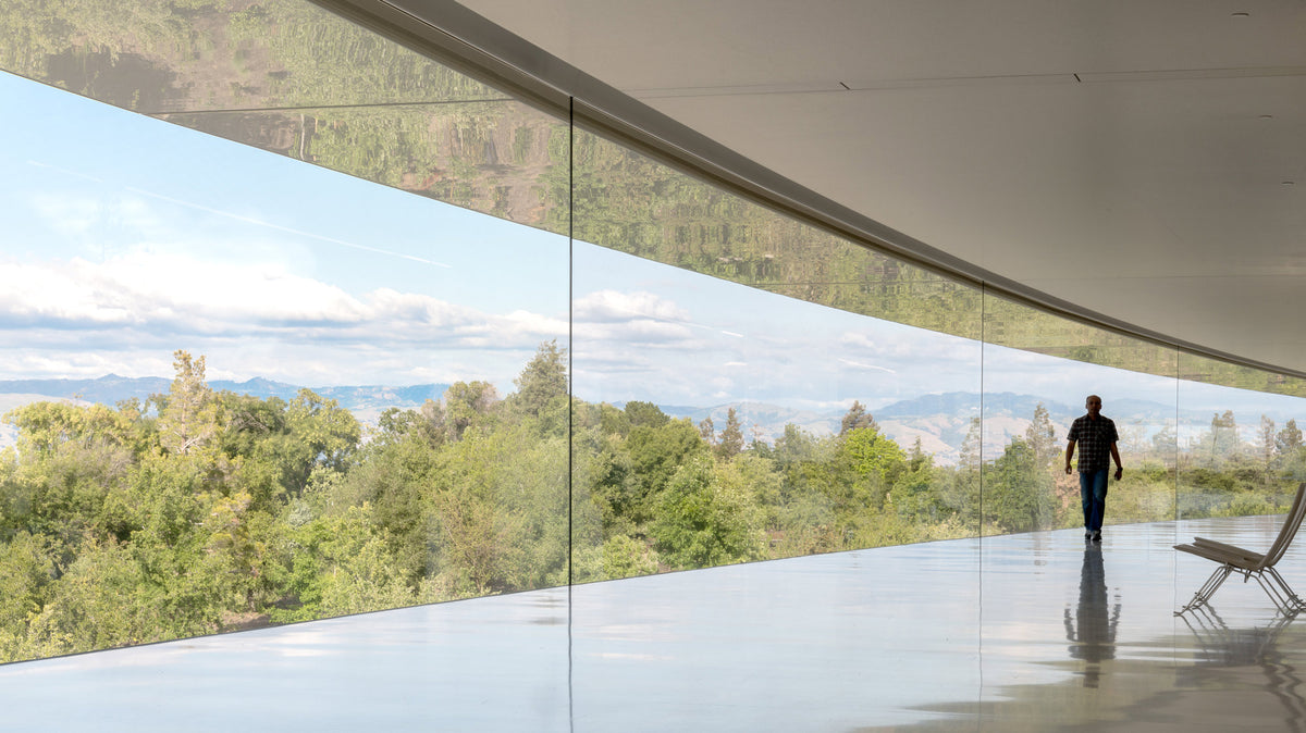 Glazed gallery in the ring building overlooking wooded hills, Apple Park, Cupertino, California